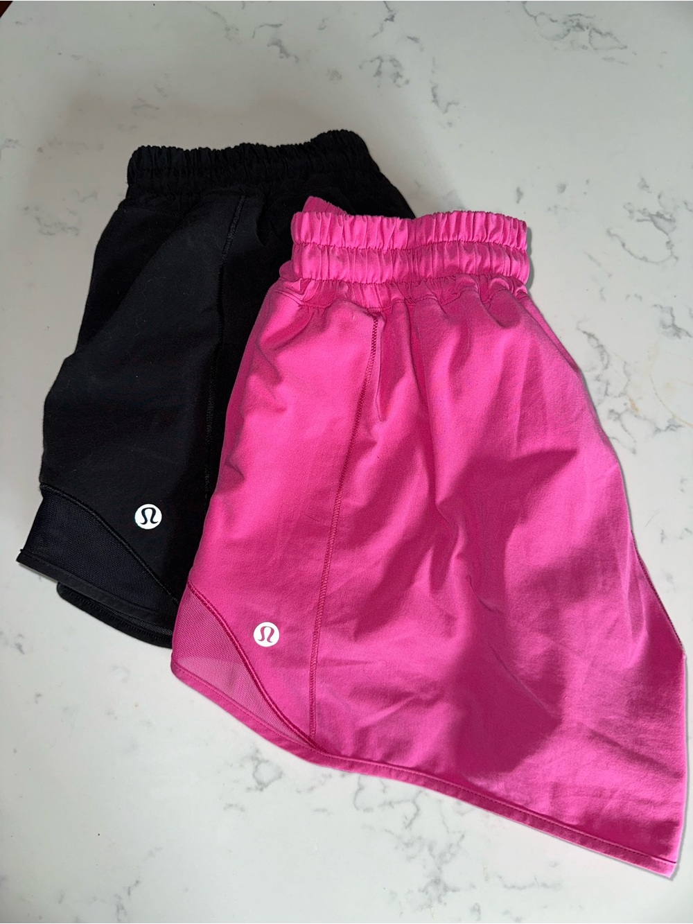 Two pairs of Lululemon Hotty Hot Shorts size 6 - 4 inches pink & black